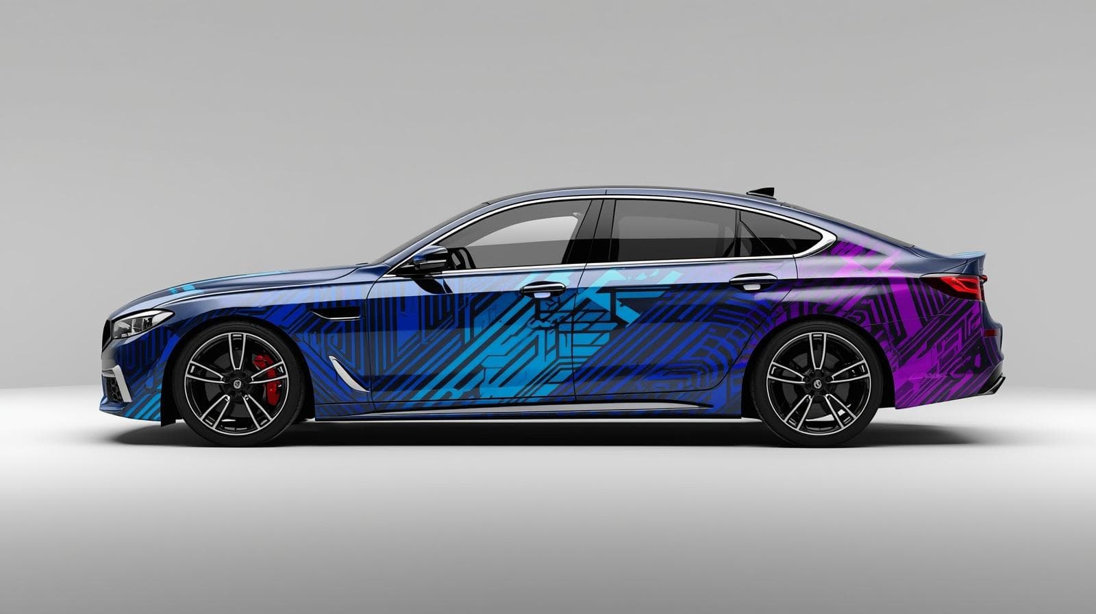 Custom car wrap with complex blue and purple geometric pattern design on sedan side profile